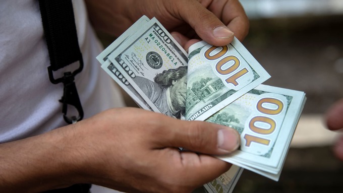 Đà tăng của USD dừng sau quyết định lãi suất của Fed